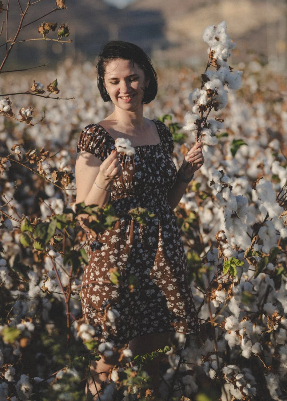 Hands working with natural organic cotton fabric