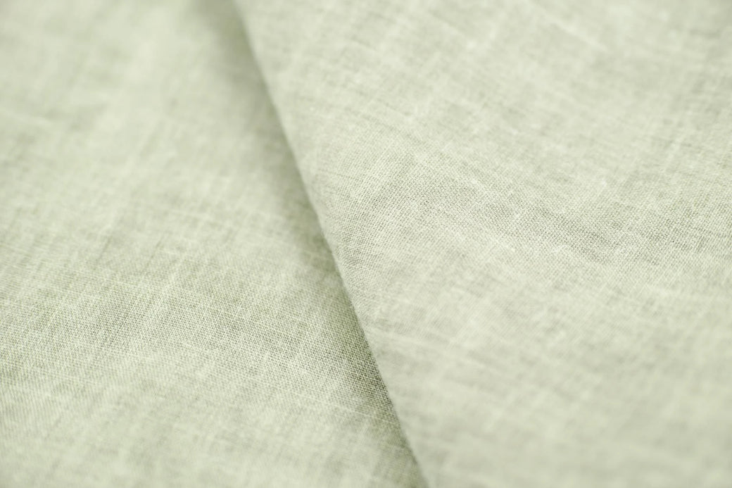 A crinkled linen swatch on natural backdrop.