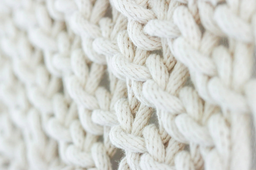 A magnified wool fiber showing natural crimp.